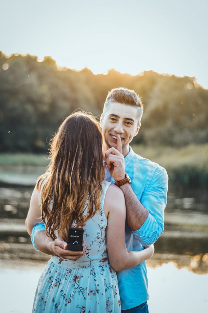 man wearing blue dress shirt proposing
